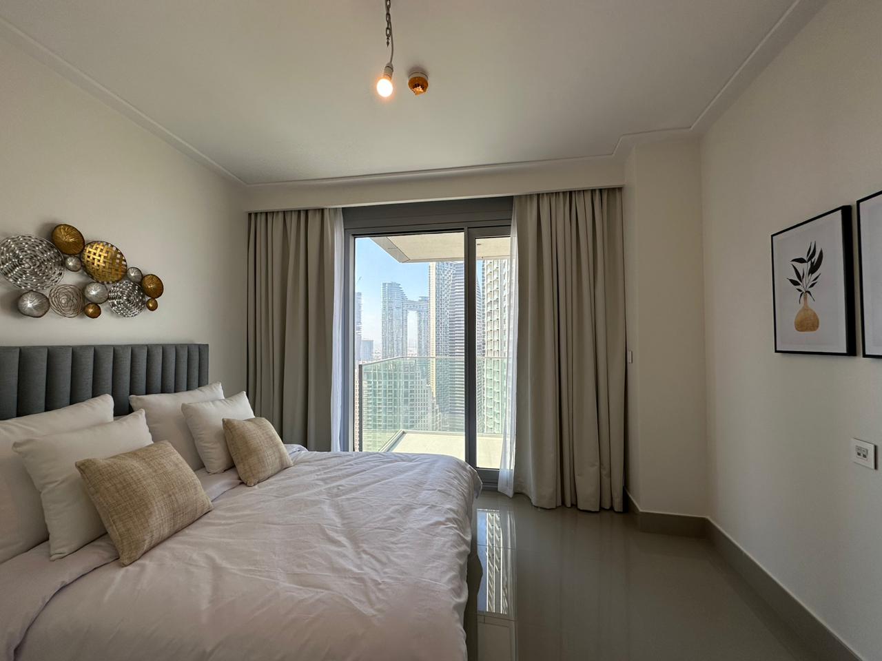 Best Curtain in Dubai 7 Luxury blackout curtains in a modern Dubai bedroom with skyline view installed by Best Curtain in Dubai (BCD)